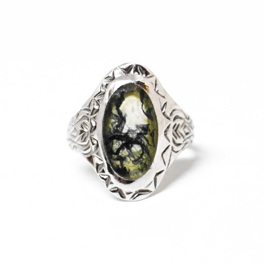 Silver ring with precious stone